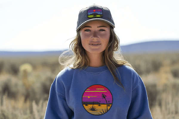 Far West embroidered cap and sweatshirt worn in the desert